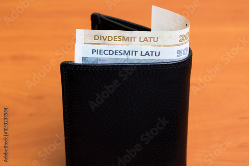 Latvian lats in the black wallet