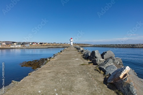 View of navigational light at the entrance to Berlevåg harbor in clear summer weather, Berlevåg, Norway.