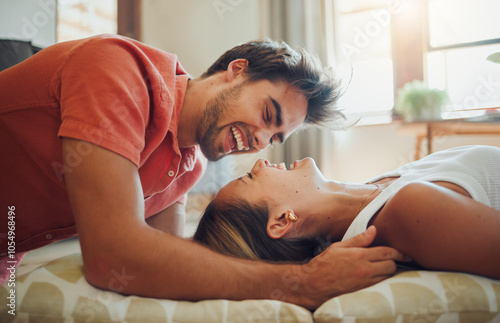 Love, laugh and happy couple on floor in home for connection, bonding or relax with partner on cushions. Living room, man and woman with funny joke, comedy and communication for relationship together