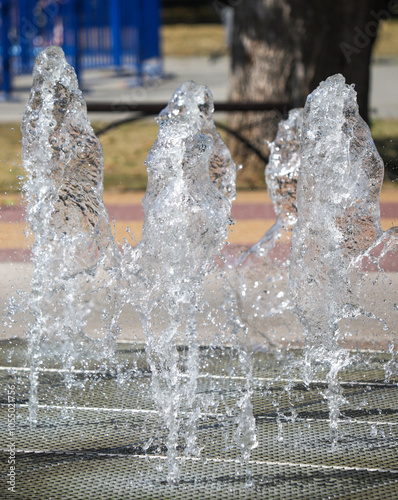 A group of water spouts are spraying water into the air