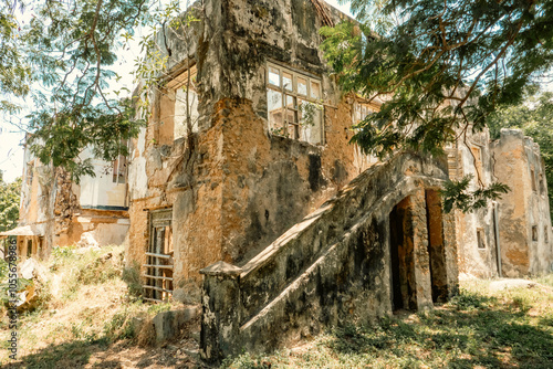 View of the architecture on the ruins of abandoned historical building in Old Stone Town Conservation Area in Bagamoyo, Tanzania 