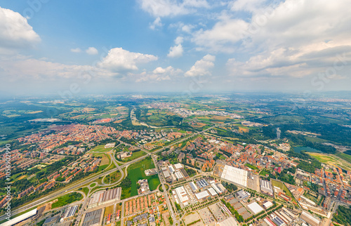 Turin, Italy. Panorama of the city in summer. Industrial and residential areas. Fields. Aerial view