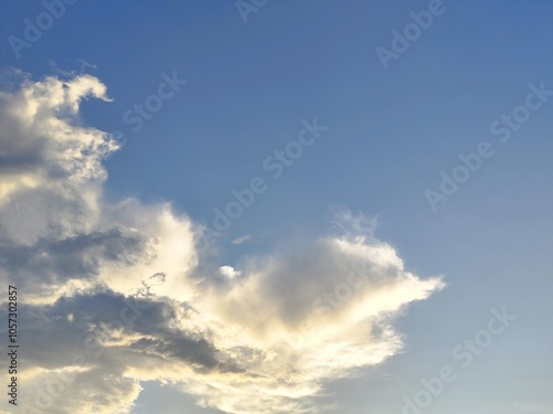 Beautiful blue sky with fluffy white clouds on a sunny day