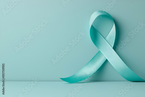 Teal awareness ribbon on a soft green background, symbolizing support for ovarian cancer, PTSD, or mental health awareness