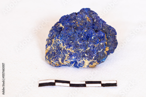 A sample of Azurite with a 5cm scale, against a white background