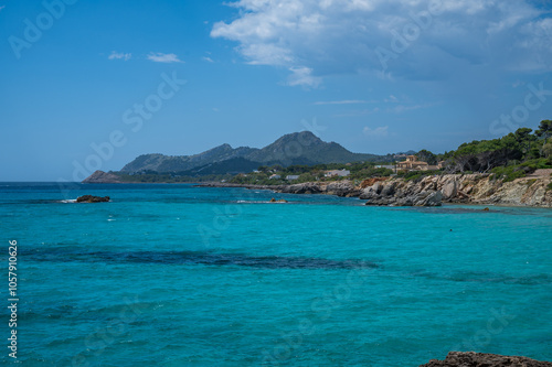 Cala Rajada near son moll beach, Mallorca with sea in front and mountain range in the background, wide angle shot, majorca spain