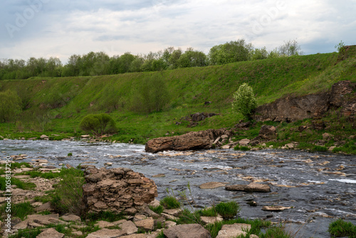 View of the Tosna River near the Tosnensky waterfall on a spring day, Sablino Railway station, village of Ulyanovka, Tosnensky district, Leningrad region, Russia