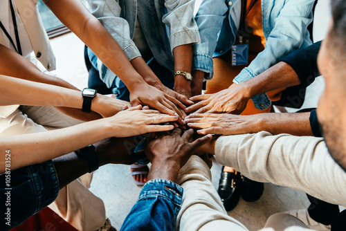 Teamwork concept with diverse hands joining together, symbolizing unity, cooperation, and collaboration