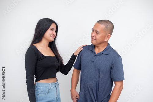 A supportive young asian woman gives reassuring and encouraging pep talk to her dad or uncle. Isolated on a white background.