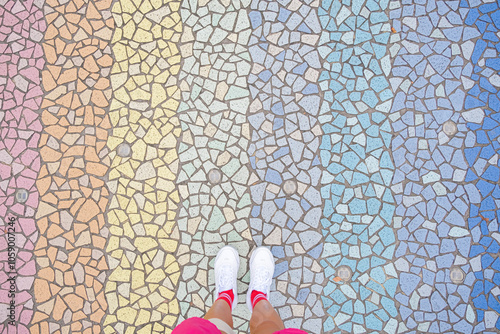 road covered with rainbow colored stones, top view