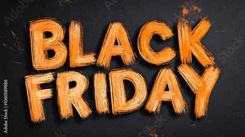 Black Friday promotional text painted in bold orange on a black background creating an eye-catching retail marketing message for shoppers