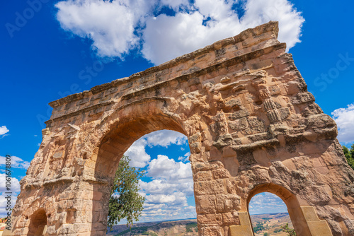 Exterior view of the Roman arch in Medinaceli, a triumphal arch made of stone using Opus Quadratum technique in Soria province, Castilla y León, Spain