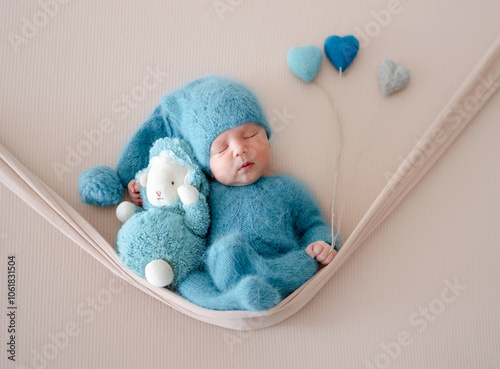 Newborn Baby Sleeps With Toy During Photo Session