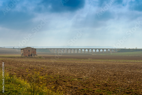 Historic railroad stone arch bridge near Spinazzola. Bridge of 21 arches.