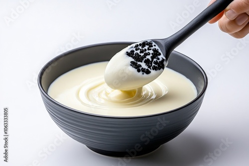 Illustration of a bowl with a spoon stirring batter, on a white background, focusing on the shapes and motion in a minimalist way