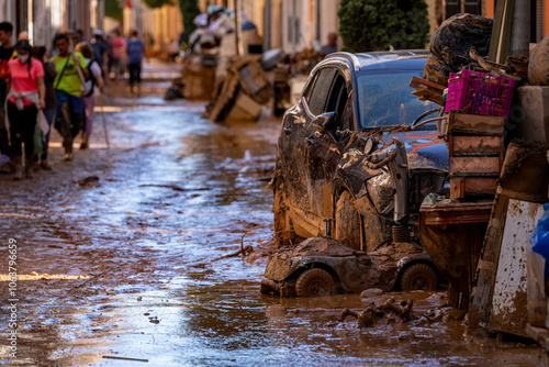 Photo shows the aftermath of the recent flood in Alfafar, Valencia, Spain. Captured are damaged homes, roads, submerged parking lots, and the efforts of residents and volunteers to clean and rebuild.