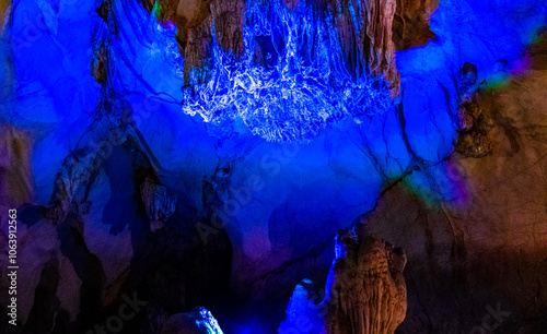 Tham Chang karst cave with limestone rocks light illumination Vang Vieng.