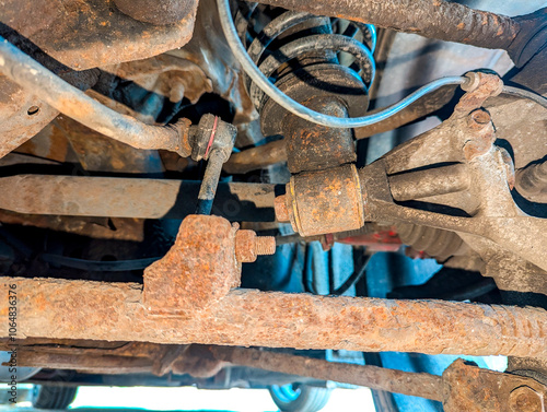 A View Underneath A Vehicle Of It's Suspension With The Underbody A Little Rusty