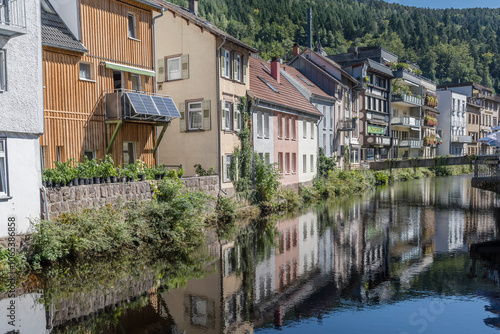 traditional houses on Gross Enz river right bank at touristic village, Bad Wildbad, Germany