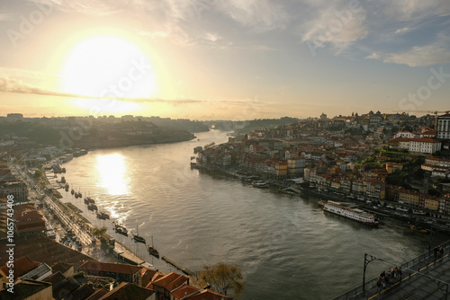 Magnificent sunset over the Porto city center and the Douro river, Portugal. Dom Luis I Bridge is a popular tourist spot as it offers such a beautiful view over the area.