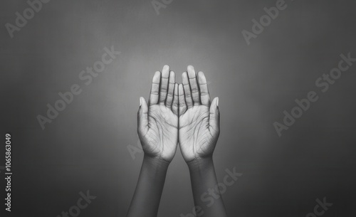 Hands reaching up in a gesture of prayer or supplication