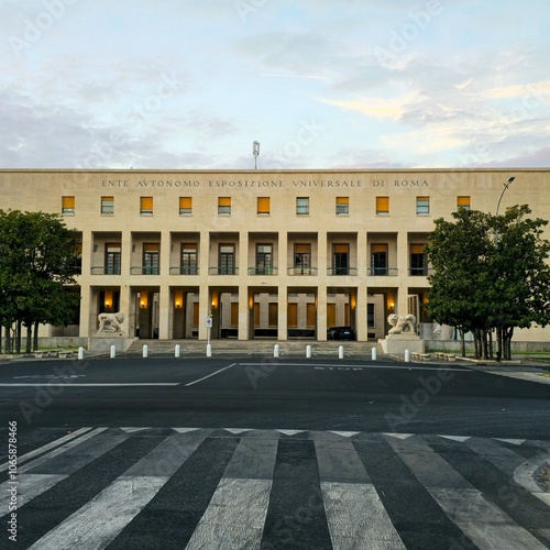 Rome, Italy - August 20, 2024: Front facade of the Ente Autonomo Esposizione Universale di Roma in viale Beethoven, Rome. An iconic example of Italian rationalist architecture with lion sculptures 