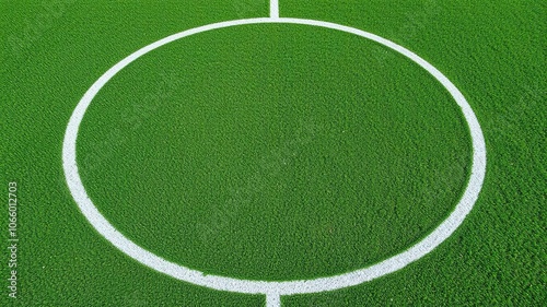 Football field with white circle drawn on green grass in a symmetrical and centered position, penalty spot, ball kicking