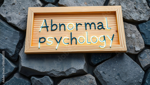 Abnormal psychology. Written on wooden surface. Wooden frame on pieces of stone. Diseases and cures isolated with white highlights, png