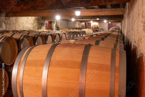 WIne celler with french oak barrels for aging of red wine made from Cabernet Sauvignon grape variety, Haut-Medoc vineyards in Bordeaux, left bank of Gironde Estuary, Pauillac, France