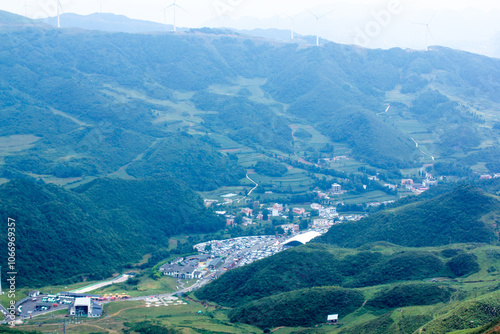 A Green Mountain with A Road Going Through lt