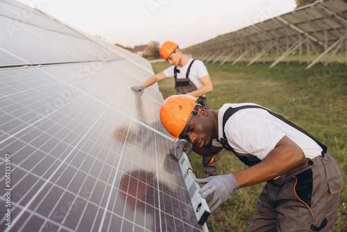 Engineers Installing Solar Panels in a Field Setting