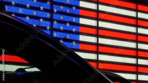 New York City Times Square, Manhattan Midtown Broadway street, USA. American flag, NYC urban life. Military island, army recruiting office. People pedestrians silhouettes, cars dark contrast shadows.