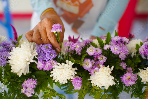 Woman's hands, flower arranger, flower decoration on stage