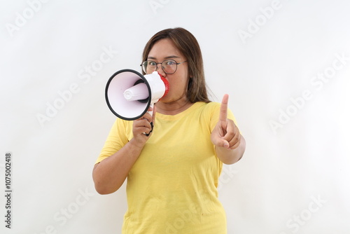 Strict woman of Asian hold scream in megaphone announces warning, discounts sale hurry up point finger up warns isolated on white background People lifestyle concept