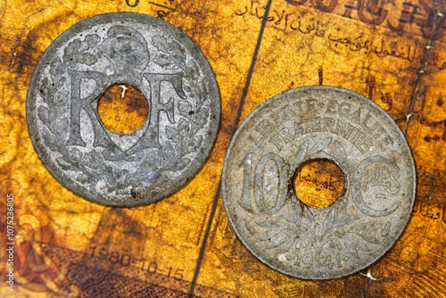 Closeup of two Vichy France ten centimes coins