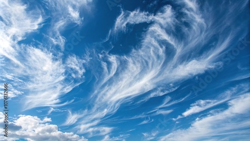 Swirling blue clouds with wispy textures, cloud formations, serene landscape