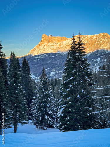 Scenic view of Heiligkreuzkofel mountain Sas dla Crusc in the Dolomites, South Tyrol, Italy in winter at sunset against blue sky