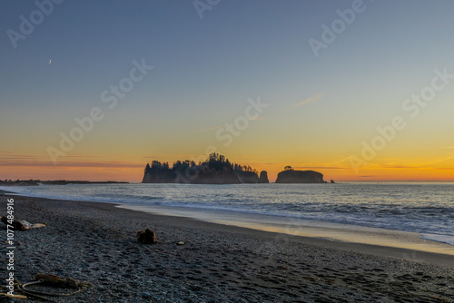 Sunset off of La Push beach in northern Washington state. Beautiful pacific northwest sunset with island silhouette in the distance