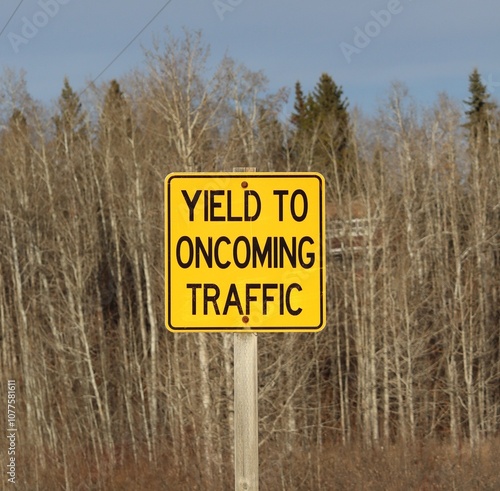 Yield to oncoming traffic road sign.