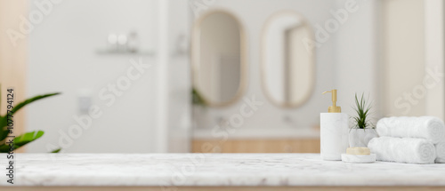 A white marble tabletop, set against a blurred background of an elegant white bathroom.