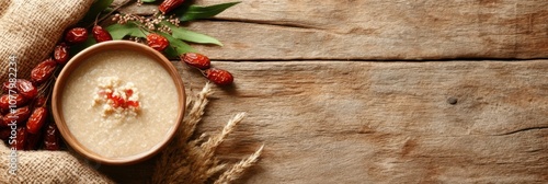 Rustic flat lay of laba festival essentials with porridge and red dates on wooden table