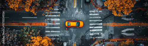 Aerial View of Vibrant Urban Intersection with Orange Car, Autumn Foliage, and Crosswalks - Ideal for Travel and Urban Design