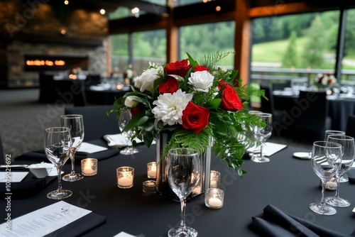 A wedding reception with a beautifully decorated table, wine glasses, and candles