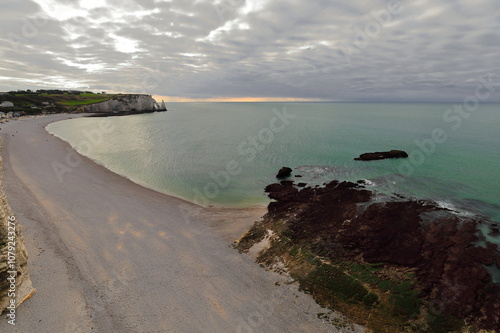 Tidal rocks, pebble beach, Falaise d'Aval Cliff, Porte d'Aval Arch and Aiguille Creuse Needle, from atop the Falaise d'Amont Cliff. Etretat-France-011