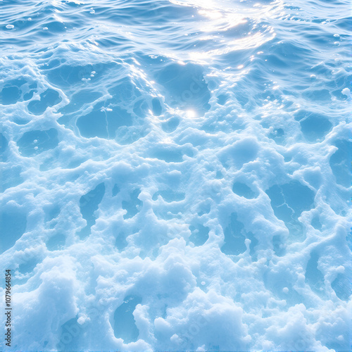 seething water. texture of blue foamy sea water. clear ocean water background. sun reflection