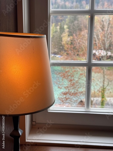 Table Lamp by Window with Forest View