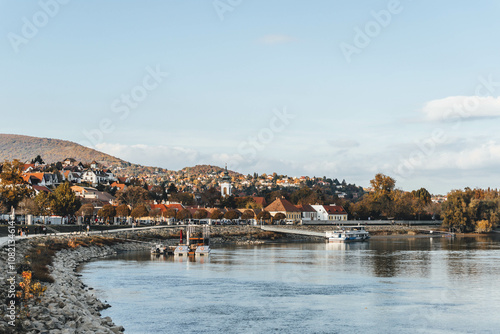 panorama view of danube river with town medieval hungarian village with many autumn leaves on wall