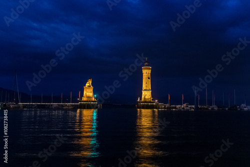 the famous lighthouse at the island of Lindau at the Bodensee by night, Germany