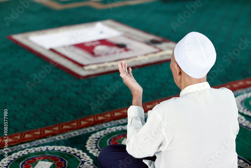 Al Akbar Surabaya National Mosque. Muslim man praying and whorship. Surabaya. Indonesia.