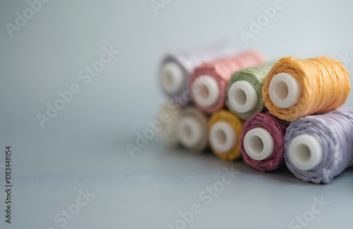 Vibrant Thread Spools in Rainbow Colors for Craft and Creation